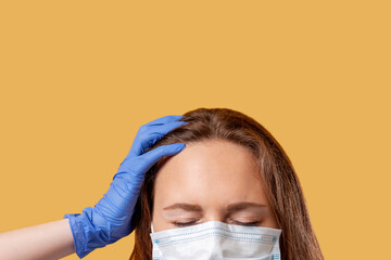 Coronavirus symptom. Infection risk. Sick woman in protective face mask gloves suffering from fever...