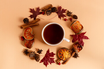 Autumn background with round frame of leaves and dried fruits