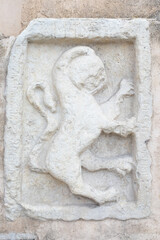 ancient stone relief. Toscany, Italy