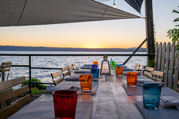 Dinner table during sunset near the beach. Bolsena Italy 