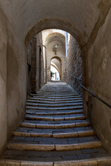 Naklejka premium old stone staircase at Marta, Lake Bolsena, Italy