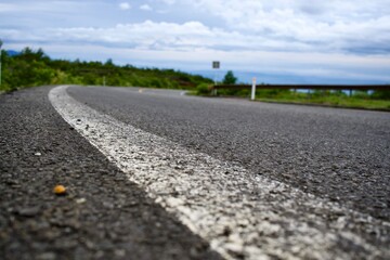 White side line on asphalt roadway in Japan.