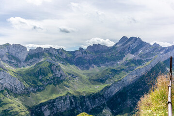 Naklejka premium The steep path leading to the majestic Schaefler peak in the Alpstein mountain range around the Aescher cliff in Appenzell, Switzerland