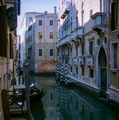 View of the  water channels, bridges and old palaces in Venice shot with analogue colour film technique