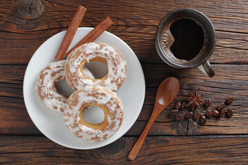 Glazed bagels and cup of coffee