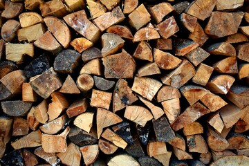 stack of cut wood logs brown pile background