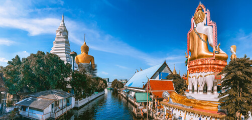 Around the khlong near Wat Paknam Bhasicharoen, a temple, pagoda and Buddha statue in Bangkok...