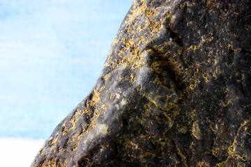 a piece of stone on blue background