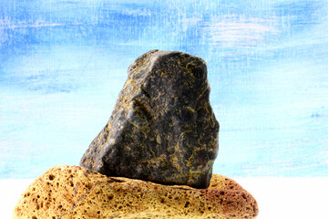 a piece of stone on blue background