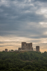 Obraz premium The ruins of the medieval castle of Csesznek sitting on a rock, Hungary