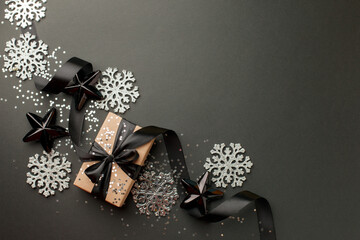 Christmas gifts, presents, ornaments on black holiday background. Merry Christmas luxury stylish...