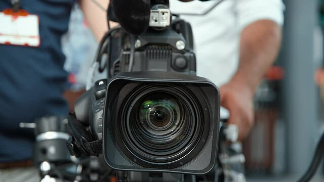 Tv camera team is preparing before shooting