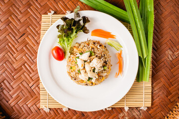 Crab meat fried rice on wooden background.