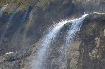 the splashes of the waterfall