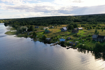 a panoramic view of the green islands on the lake with ships with ancient architectural buildings filmed from a drone
