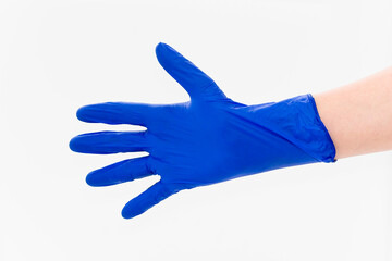 Hand in a blue diagnostic glove