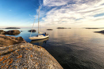 Sailboat and remote islets in Stockholm archipelago