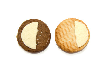 halves of chocolate and white biscuits isolated on white.