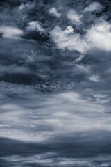 Dramatic dark gray sky after storm. Vertical photo.