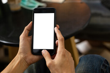 man hand using smartphone In the coffee shop,Screen blank with clipping path