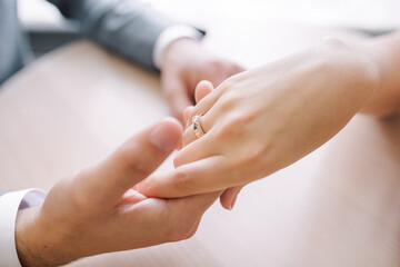 gentle touch of the hands of a man and a woman. husband gently strokes his wife on the hand,