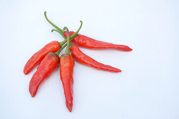 bunch the red ripe chilly isolated on white background.