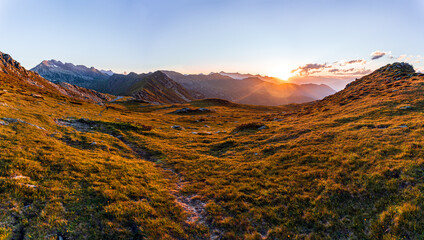 The sunset over the mountains of Lombardy while giving fantastic colors near the San Marco Pass, Italy - June 2020.