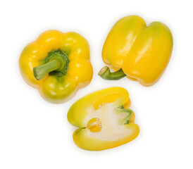 Fresh sweet peppers with separate leaves on a white background, top view