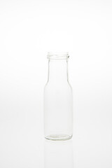 Isolated glass bottle on white background without cap.