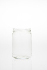 Isolated glass bottle on white background without cap.