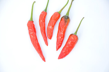 bunch the red ripe chilly isolated on white background.