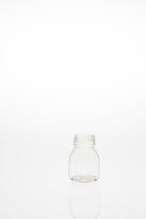 Obraz na płótnie Canvas Isolated glass bottle on white background without cap.