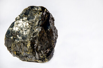 Coal on a white background. Fossil coal close-up. Coal. Coal anthracite. Coal close-up. Heating season. Mineral fossil © Pavlo