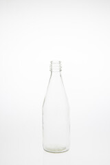 Isolated glass bottle on white background without cap.