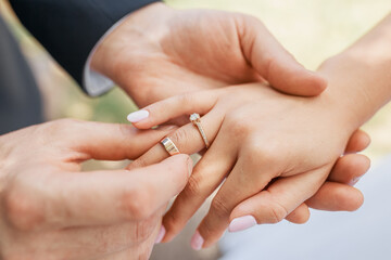 Wedding couple exchanging wedding rings. Wedding rings.