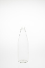Isolated glass bottle on white background without cap.