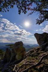 Sun between two rocks at mount Peilstein