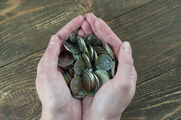 coins in the palms, Russian money, the concept of savings
