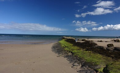 Rocky inlet leading out to a sunny September sea.