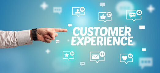 Close-Up of cropped hand pointing at CUSTOMER EXPERIENCE inscription, social networking concept