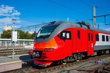 Fototapeta na wymiar Red train in modern railway