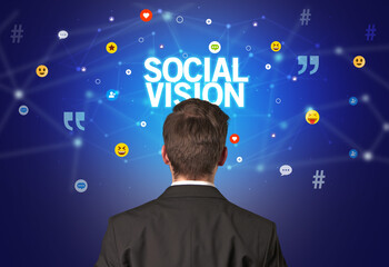 Rear view of a businessman with SOCIAL VISION inscription, social networking concept