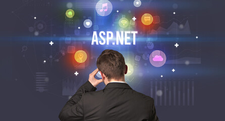 Rear view of a businessman with ASP.NET inscription, modern technology concept