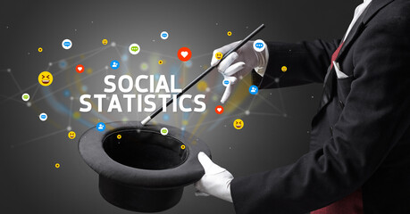 Magician is showing magic trick with SOCIAL STATISTICS inscription, social media marketing concept