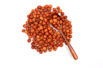 Nuts hazelnut in a wooden spoon on a white background