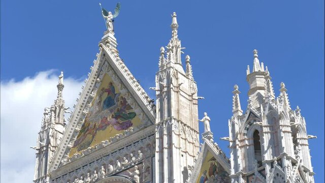 Time Lapse of Medieval church "Santa Maria Cathedral" dedicated to the Assumption of the Blessed Virgin Mary in Siena, Tuscany, Italy