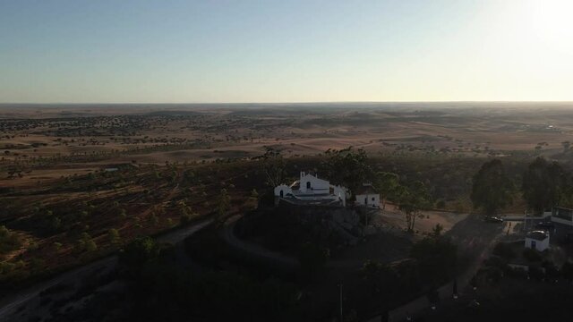 Ermida de Nossa Senhora de Aracelis aerial view, a hermitage and church perched on a Alentejo hill, looking out on beautiful views across the cultivated plateau. Portugal.