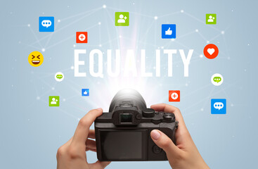 Using camera to capture social media content with EQUALITY inscription, social media content concept
