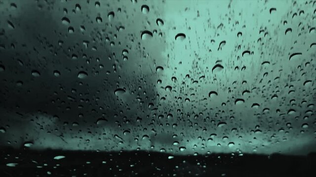 Slow Motion of Rain Water Droplets On The Car Glass With Dark And Cloudy Gloomy Background 1080 FHD