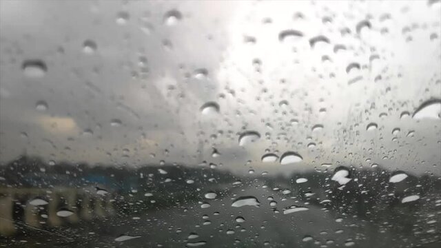 Slow Motion Of Rain Drop Water On Glass Of A Moving Car On A Highway FHD 1080P